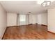 Bright living room featuring wood-look tile floors and large windows at 907 Shasta Rd, Venice, FL 34293