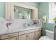 Bathroom featuring a glass vessel sink, marble countertops, and white cabinets, a spa-like retreat at 922 Casey Cove Dr, Nokomis, FL 34275