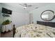Bedroom with a floral comforter and plenty of closet space at 922 Casey Cove Dr, Nokomis, FL 34275