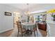Charming dining room with a round table and access to the kitchen at 922 Casey Cove Dr, Nokomis, FL 34275