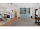 Elegant dining room with a built-in shelving unit and fireplace at 922 Casey Cove Dr, Nokomis, FL 34275