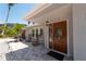 Inviting front entrance with rocking chairs and a paved walkway at 922 Casey Cove Dr, Nokomis, FL 34275