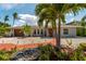 Lovely home with mature palm trees, nice landscaping, and brick walkway, providing a tropical paradise at 922 Casey Cove Dr, Nokomis, FL 34275