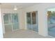 Gathering room with water views and sliding glass doors at 922 Casey Cove Dr, Nokomis, FL 34275