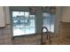 Gourmet kitchen with stainless steel faucet and marble countertops overlooking a pool at 922 Casey Cove Dr, Nokomis, FL 34275