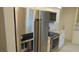 Open kitchen featuring stainless steel appliances and white cabinets at 922 Casey Cove Dr, Nokomis, FL 34275