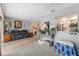Living room with gray leather couches and a view of the kitchen at 922 Casey Cove Dr, Nokomis, FL 34275