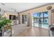 Living room with sliding doors to the pool and canal view at 922 Casey Cove Dr, Nokomis, FL 34275