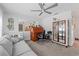 Home office featuring a desk, comfortable sofa, and built-in shelving at 922 Casey Cove Dr, Nokomis, FL 34275