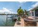 Fire pit and seating area on waterfront patio at 922 Casey Cove Dr, Nokomis, FL 34275