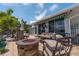 Relaxing patio with fire pit and seating at 922 Casey Cove Dr, Nokomis, FL 34275