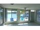 Bright sunroom featuring waterfront views and access to outdoor seating at 922 Casey Cove Dr, Nokomis, FL 34275