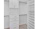 Walk-in closet featuring multiple shelves, drawers, and lots of hanging storage at 10055 Crooked Creek Dr # 102, Venice, FL 34293
