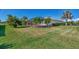 Large backyard with grassy lawn at 11679 Anhinga Ave, Venice, FL 34292