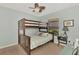 bedroom with a bunk bed and window at 11679 Anhinga Ave, Venice, FL 34292