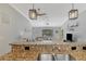 Close-up of kitchen breakfast bar with granite countertops overlooking spacious and comfortable Gathering room at 11679 Anhinga Ave, Venice, FL 34292