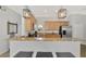Modern kitchen with stainless steel appliances and granite countertops at 11679 Anhinga Ave, Venice, FL 34292