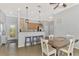 Bright kitchen with stainless steel appliances, breakfast bar, and pendant lighting at 11679 Anhinga Ave, Venice, FL 34292
