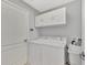 Laundry room with washer, dryer, and sink at 11679 Anhinga Ave, Venice, FL 34292