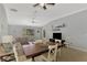 Bright open-concept living room featuring tile flooring and vaulted ceiling at 11679 Anhinga Ave, Venice, FL 34292