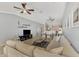 Open-concept living space featuring tile flooring and abundant natural light at 11679 Anhinga Ave, Venice, FL 34292