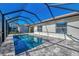 Screened-in pool and patio area, perfect for outdoor entertaining with a spacious deck and sunny skies at 11679 Anhinga Ave, Venice, FL 34292