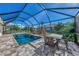 Inviting screened pool area with patio furniture at 11679 Anhinga Ave, Venice, FL 34292