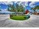 Relaxing town square with artificial turf and colorful seating at 11679 Anhinga Ave, Venice, FL 34292