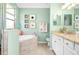 Bathroom with double vanity, soaking tub and shower at 12313 Amica Loop, Venice, FL 34293