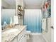 Clean bathroom, featuring granite countertops and a tub shower combo at 12313 Amica Loop, Venice, FL 34293