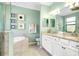 Spa-like bathroom with soaking tub and walk-in shower at 12313 Amica Loop, Venice, FL 34293