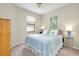 Bedroom with a queen-size bed and built-in wardrobe at 12313 Amica Loop, Venice, FL 34293