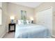 Bedroom with a queen-size bed and built-in wardrobe at 12313 Amica Loop, Venice, FL 34293