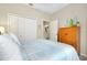 Bedroom with a queen-size bed and built-in wardrobe at 12313 Amica Loop, Venice, FL 34293