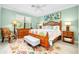 Bright bedroom with a king-size bed, and a sitting area at 12313 Amica Loop, Venice, FL 34293