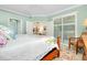 Spacious bedroom with a king bed and access to the living room at 12313 Amica Loop, Venice, FL 34293