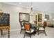 Charming dining area with glass table and unique decor at 12313 Amica Loop, Venice, FL 34293