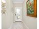 Elegant entryway with patterned rug and decorative art at 12313 Amica Loop, Venice, FL 34293