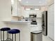 Modern kitchen with breakfast bar and stainless steel appliances at 12313 Amica Loop, Venice, FL 34293