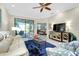 Spacious living room with comfortable seating and a view to the dining area at 12313 Amica Loop, Venice, FL 34293