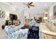 Living room with comfortable seating and a large TV at 12313 Amica Loop, Venice, FL 34293