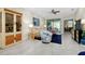 Bright living room with comfy seating and access to a patio at 12313 Amica Loop, Venice, FL 34293
