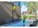 Outdoor patio with table, chairs, and plants, perfect for dining al fresco at 12313 Amica Loop, Venice, FL 34293