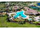 Resort-style pool with lounge chairs and surrounding landscaping at 12313 Amica Loop, Venice, FL 34293