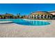 Stunning resort-style pool with a curved design and ample lounge space at 12313 Amica Loop, Venice, FL 34293