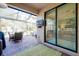 Covered patio with outdoor seating and sliding glass doors at 12313 Amica Loop, Venice, FL 34293