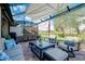 Patio with covered seating and dining area at 12313 Amica Loop, Venice, FL 34293
