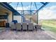 Outdoor patio with dining table and seating area at 12313 Amica Loop, Venice, FL 34293
