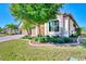 Landscaped yard with a large tree near the house at 13722 Vancanza Drive, Venice, FL 34293
