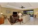 Spacious living area with large TV and comfy seating at 13722 Vancanza Drive, Venice, FL 34293